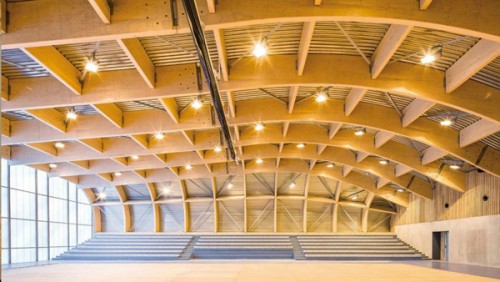 Stunning new wooden sports center in Paris is hidden underneath sprawling green roof